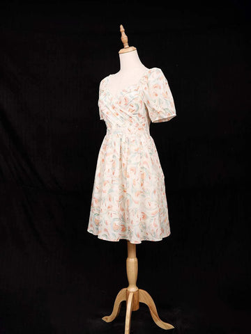 Ivory Frock Adorned with Floral and Ruffled Design - Diadem