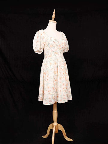 Ivory Frock Adorned with Floral and Ruffled Design - Diadem