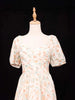 Ivory Frock Adorned with Floral and Ruffled Design - Diadem