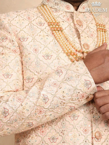 Cream Raw Silk Sherwani Suit with Floral Threadwork Embroidery, Paired with Bead Mala - Diadem