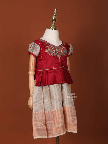 Peach and Maroon Silk Pattu Pavadai Adorned with Floral Embroidery and Zariwork - Diadem