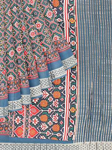 Teal Semi Tussar Silk Saree with Patola Prints on the body and Zari Border - Diadem