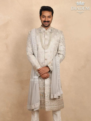 Ash Raw Silk Sherwani with Floral Threadwork Embroidery Paired with Dupatta and Bead Mala - Diadem