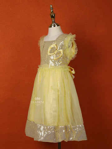 Light Yellow Net Gown Embellished with Sequins and attached Bow - Diadem