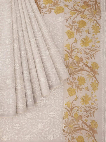 Ivory and Mustard Yellow Organza Silk Saree with Floral Prints on the body and Embroidery Border - Diadem