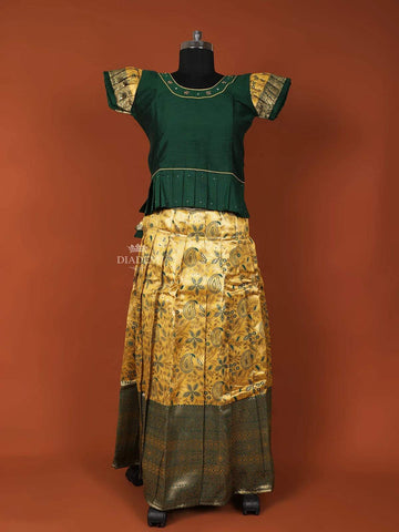 Dark Green Silk Pattu Pavadai Set Adorned with Stones and Zariwork - Diadem