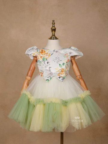 Light Green Satin with Net Frilled Gown Adorned with Floral Prints and Attached Bow - Diadem