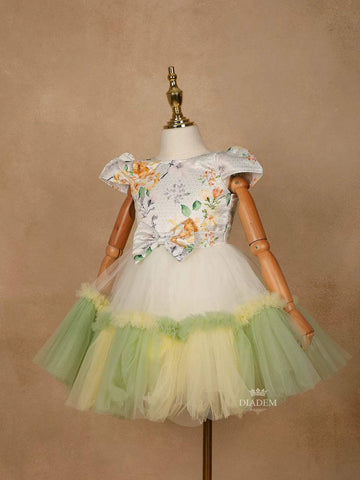 Light Green Satin with Net Frilled Gown Adorned with Floral Prints and Attached Bow - Diadem
