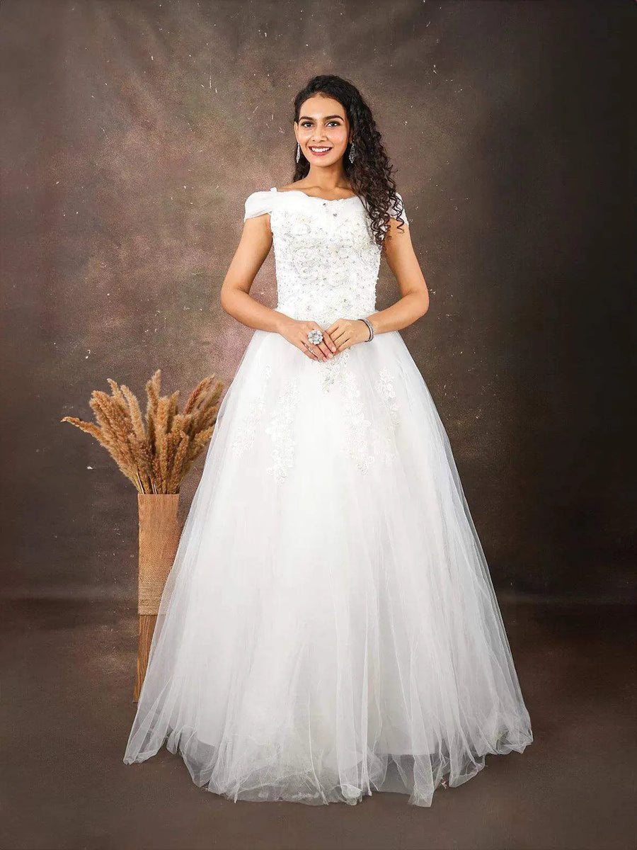 Discover elegance in our white net gown embellished with floral threadwork  embroidery and sequins at Diadem Find your perfect dress now!