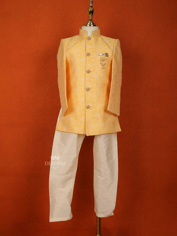 Light Orange Raw Silk Sherwani Suit Adorned with Embossed Embroidery paired with Brooch - Diadem