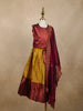 Maroon And Mustard Yellow Zari Woven Raw Silk Pattu Pavadai With Dupatta