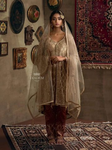 Gold-Net Straight Cut Salwar Suit with Stone Embellishments along with Brocade Pants and Embroidered Net Dupatta - Diadem