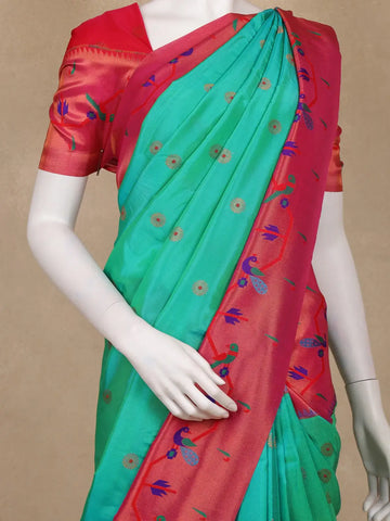 Sea Green Floral Woven Banarasi Silk Saree With Contrast Red Border - Diadem