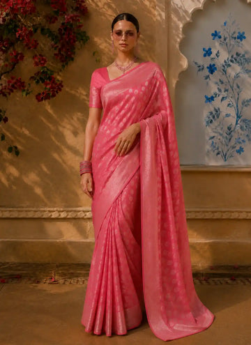Model wearing pink reception designer saree