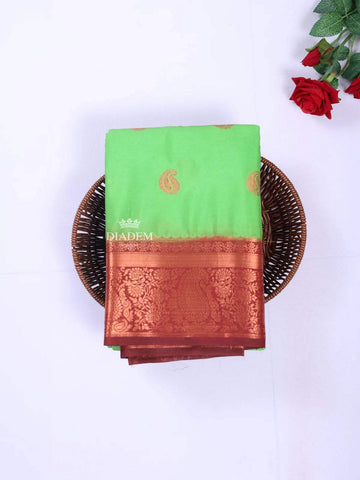 Green Art Silk Saree with Paisley Motif on the body and Contrast Zari Border - Diadem