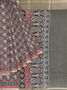 Olive Green Semi Tussar Silk Saree with Patola Prints on the body and Contrast Zari Border