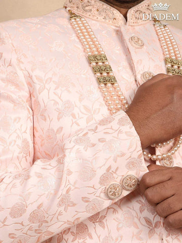 Light Pink Jacquard Sherwani Suit with Floral Emboss paired with Bead Mala - Diadem