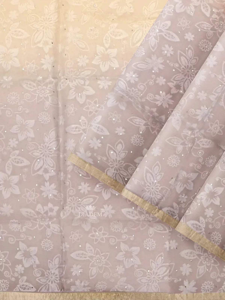 Beige Organza Silk Saree with Floral Prints on the body and Zari Border - Diadem