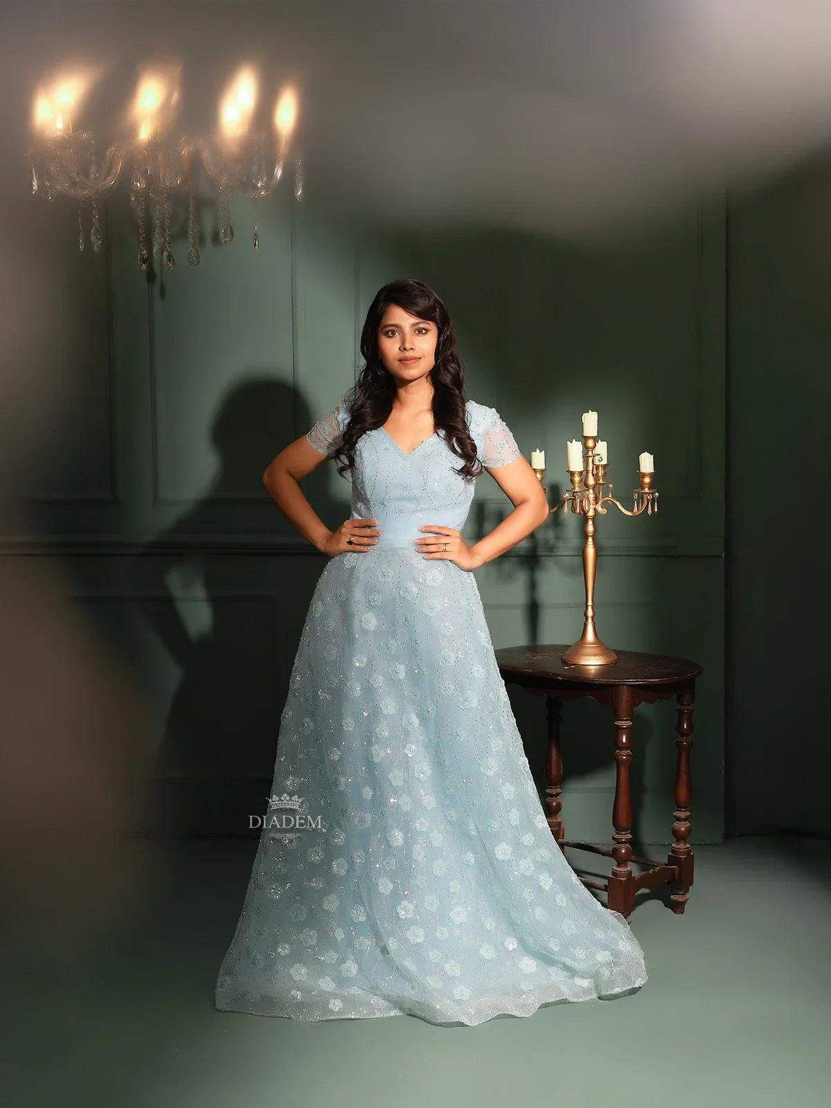 Step into elegance with our Light Blue Net Gown embellished with sequins and beads. Available at Diadem Store. Shop now