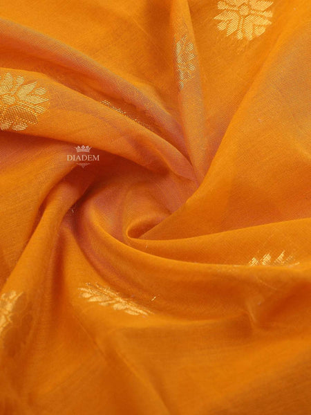 Yellow Silk cotton Saree with floral motif design on the body and contrast pink zari border - Diadem