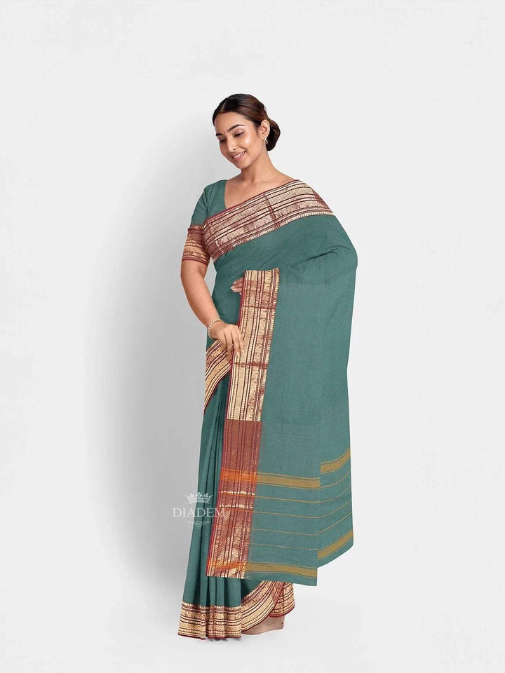 Green Kanchi Cotton Saree with Plain Thread Butta on the body and Zari Border - Diadem