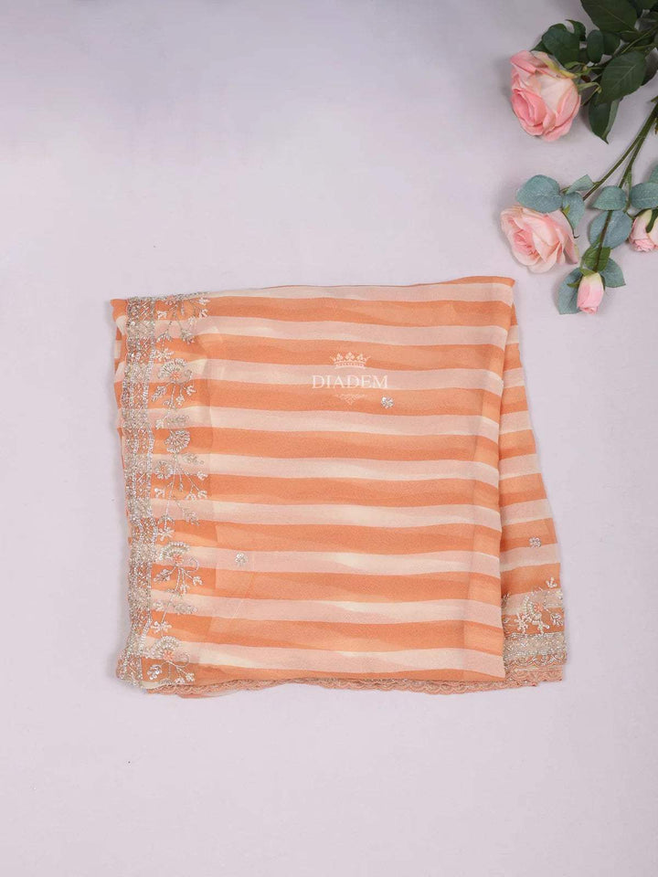 Orange Organza Saree with Stripes Designs on the body and Embroidery Border - Diadem