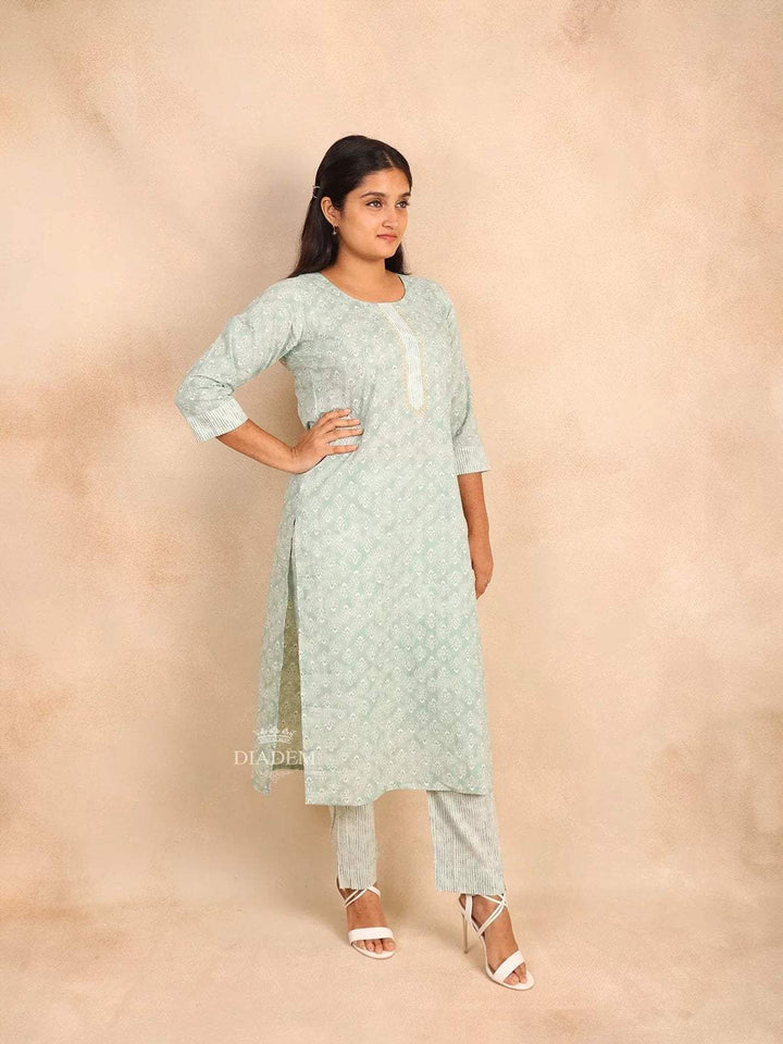 Mint Green Cotton Straight Cut Salwar Suit Adorned with Floral Prints and Sequins - Diadem