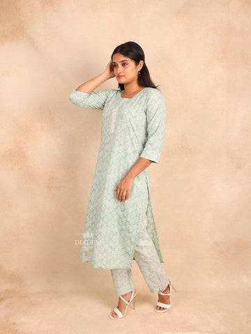 Mint Green Cotton Straight Cut Salwar Suit Adorned with Floral Prints and Sequins - Diadem