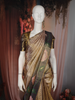 Antique Gold Geometric Woven Tissue Silk Saree with Contrast Floral Border