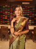 Antique Olive Green Jhumka Butta Zari Woven Design Semi Silk Traditional Wear Saree with Contrast Pallaku Zari Border