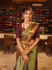 Antique Olive Green Jhumka Butta Zari Woven Design Semi Silk Traditional Wear Saree with Contrast Pallaku Zari Border