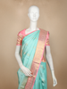 Aqua Blue Floral Butta Woven Pure Kanchipuram Silk Saree with Contrast Pink Zari Border