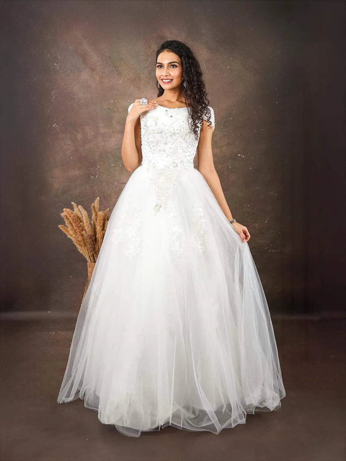 White Net Gown Embellished with Floral Thread Work Embroidery Diadem