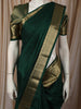 Bottle Green Solid Woven Design Pure Kanchipuram Silk Saree with Zari Border