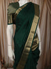 Bottle Green Solid Woven Design Pure Kanchipuram Silk Saree with Zari Border