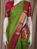 Bright Leaf Green Traditional Butta Woven Design Pure Kanchipuram Silk Saree with Contrast  Zari Border
