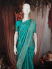 Bright Turquoise Blue Floral Vine Zari Woven Design Semi Banarasi Silk Saree with Designer Border