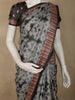 Charcoal Grey Ikat Printed Design Semi Tussar Saree with Striped Border