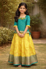 Yellow and Green Silk Pattu Pavadai Adorned with Stones and Zari Work