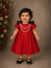 Red Denim Cotton Frock with Attached Bow and Beaded Mala