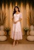 Light Pink Frock Adorned with Flower Designs
