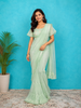 Mint Chiffon Ruffle Saree Adorned with Floral Thread work along with Ruffle Blouse