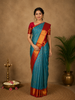 Peacock Blue Floral Woven Pure Kanchipuram Silk Saree With Contrast Border