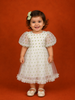 Cream Net Frock Adorned with Heart Prints and Puff Sleeves