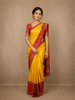 Mustard Yellow Checks Design Silk Saree with Red Border And Peacock Motifs