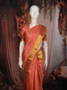 Coral Peach Floral Butta Zari Woven Design Pure Kanchipuram Silk Saree with Zari Border