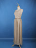 Cream Sleeveless Netted Gown With Sequin Embellishments And Waist Belt
