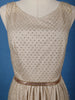 Cream Sleeveless Netted Gown With Sequin Embellishments And Waist Belt