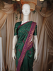 Deep Bottle Green Abstract Zari Woven Design Semi Tussar Saree with Contrast Temple Zari Border