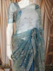 Dusty Blue Floral Vine Stone Embellished Design Pure Tissue Silk Party Wear Saree with Scalloped Border